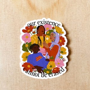 May include: A sticker with a colorful illustration of three women surrounded by flowers. The text "our existence cannot be erased" is written around the women.