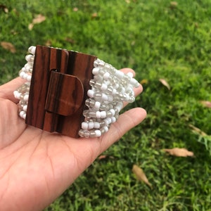 Adjustable Elastic Stretch 16 Multi Strands White Translucent White Glass Beads Beaded Women Bracelet With Wooden Buckle Clasp Closure.
