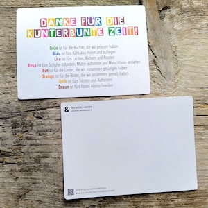 May include: A colorful thank you card with the text "DANKE F&Uuml;R DIE KUNTERBUNTE ZEIT!" and a list of colors and their meanings in German. The card is on a wooden surface.