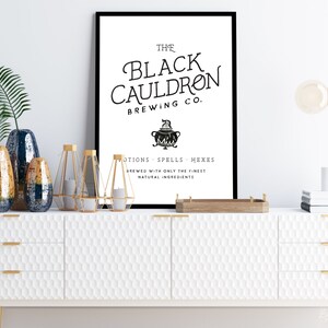 May include: Black and white print of a logo for a brewery called "The Black Cauldron Brewing Co.". The logo features a cauldron with flames and the text "Motions - Spells - Hexes" and "Brewed with only the finest natural ingredients".
