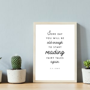 May include: A white framed print with a black and white quote by C.S. Lewis that reads "Some day you will be old enough to start reading fairy tales again."