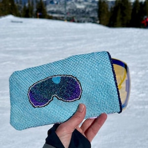 May include: A set of three ceramic mugs with a speckled, matte finish. The mugs are in shades of cream, light gray, and dark gray. Each mug has a simple, minimalist design, perfect for coffee or tea.