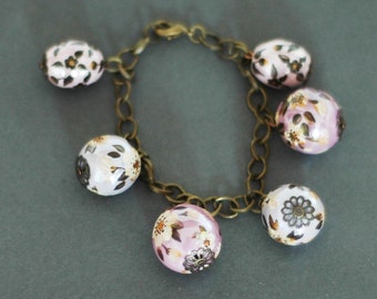 Charm bracelet with hand painted ceramic beads