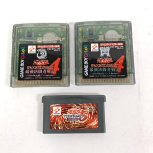 May include: Three video game cartridges. Two are Game Boy Color cartridges with black labels and Japanese text. The third is a Game Boy Advance cartridge with a red and orange label and Japanese text.