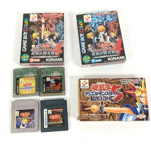 May include: A selection of retro Game Boy Color and Game Boy Advance video game cartridges and boxes. The boxes display vibrant anime artwork and Japanese text. The cartridges are in various colours, including green and grey.