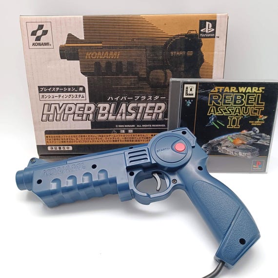 Pistolet Optique Konami Hyper Blaster PS1 - Compatible PS1 Et PS2, Couleur Bleue, Testé Fonctionnel, Occasion