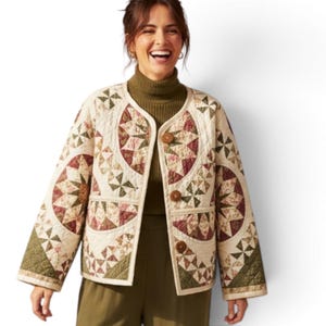 May include: A cream-colored quilted jacket featuring a circular patchwork pattern in shades of olive green, burgundy, and tan. The jacket has a collarless neckline, long sleeves, and three large brown buttons down the front closure.