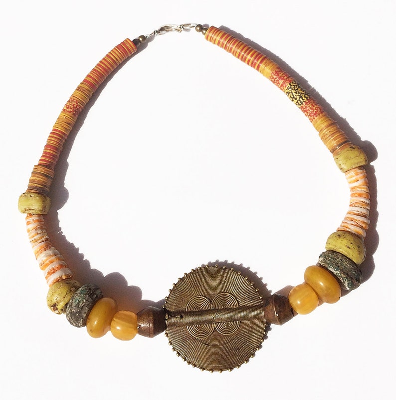 GWG Necklace 02 ~ Sunny Day\u2014ANTIQUE VTG Beads\u2014Lobi brass sun disk\u2014old resin egg yolk amber\u2014Hebrons\u2014rare colors vulcanite\u2014old bronze beads