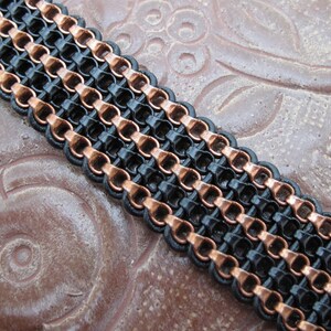 Women&#39;s Bracelet - bronze and black chain, black leather and a bronze magnetic clasp. 7 inches.