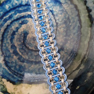 Women&#39;s Bracelet - silver chain, light blue leather, blue rhinestone. Magnetic clasp. 7 3/4 inches.