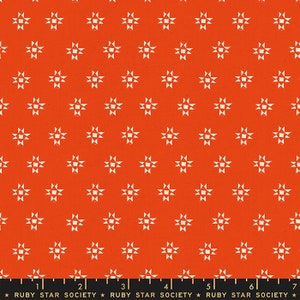 May include: Red fabric with a white repeating pattern of small stars. The fabric has a textured surface and the text "RUBY STAR SOCIETY" is printed at the bottom.