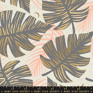 May include: A cream-colored fabric with a repeating pattern of gold and gray tropical leaves. The leaves have a textured, hand-painted look. The background is dotted with small gold dots.