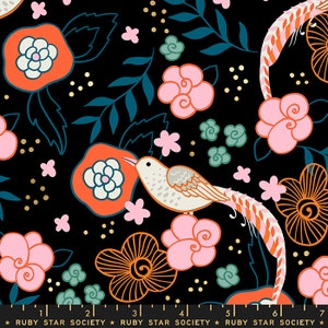 May include: Black fabric with a repeating pattern of pink, orange, and white flowers, green leaves, and a stylized bird with a long tail. The fabric has a gold glitter pattern.