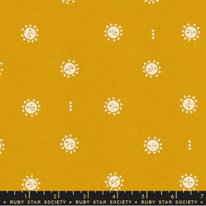 May include: A yellow fabric with a repeating pattern of white stylized suns. The suns have a face with closed eyes and a small smile. The fabric has a textured surface.