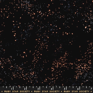 May include: Black fabric with a speckled pattern. The design features small, irregularly shaped dots in shades of peach and gray scattered across the dark background. The text "RUBY STAR SOCIETY" is printed at the bottom.