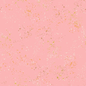 May include: A pink background with a scattered pattern of small white, gold, and brown dots.