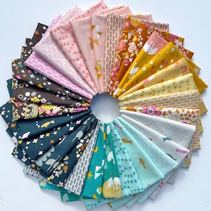 May include: A collection of 24 fabric squares in a variety of colors and patterns, arranged in a circle. The fabrics feature geometric designs, floral motifs, and abstract patterns. The colors include teal, yellow, pink, brown, and white.