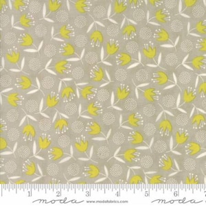 May include: A gray fabric with a repeating pattern of yellow stylized flowers and white dots. The fabric has a ruler with the word "moda" printed on it.