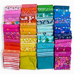 May include: A selection of fabric bundles in a range of colours and patterns. The fabrics feature floral, geometric, and abstract designs in pink, orange, yellow, green, blue, and purple. The bundles are neatly stacked, displaying the variety of textiles available.