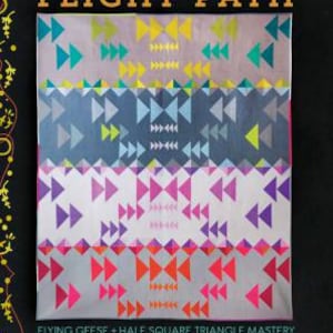 May include: A quilt pattern book titled "Flight Path" by Mary Menzer and Alison Glass. The book features a colorful quilt design with a geometric pattern of triangles and arrows. The book is part of the "Skill Builder Series" and includes instructions for making a quilt using the "Flying Geese" and "Half Square Triangle" techniques.