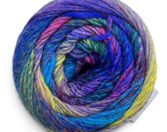 May include: A round ball of yarn featuring a variegated color palette of deep blue, bright magenta, lime green, and purple. The fibers are twisted into a thick, multi-colored strand that spirals inward toward the center of the circular yarn cake.