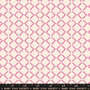 May include: Cream-colored fabric with a repeating pattern of pink pixelated diamonds. The fabric is marked with a black ruler along the bottom, with the text "RUBY STAR SOCIETY" printed on it.