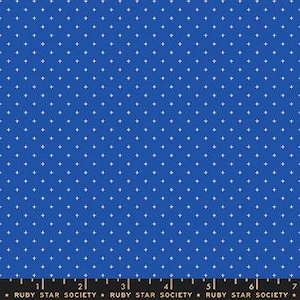 May include: Royal blue fabric featuring a repeating pattern of small white plus signs. A ruler along the bottom edge shows measurements in inches. The text "RUBY STAR SOCIETY" is printed along the bottom.