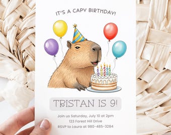 May include: A birthday invitation featuring a capybara wearing a party hat, with balloons and a cake with lit candles. The text reads "IT'S A CAPY BIRTHDAY!" and "TRISTAN IS 9!" with event details below. The invitation is held by a hand.