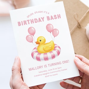 May include: A birthday invitation with the text "SPLISH, SPLASH! IT'S A BIRTHDAY BASH" in pink. The invitation features a yellow rubber ducky in a pink and white striped inner tube, with pink balloons. The text "MALLORY IS TURNING ONE!" is also visible.
