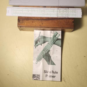 Vintage Faber Castell 57/87 Slide Ruler Made In Germany In Case w. manual.