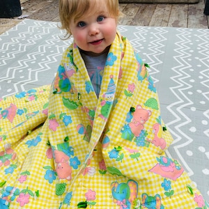 1980s Baby Quilt. 54&quot; by 39&quot;. Teddy Bear Print. Adorable yellow vintage baby decor. Yellow, Blue, Pink. Gender Neutral infant. Sweet.