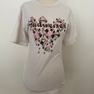 90’s beat up old Budweiser tee. Thin and soft. No tags. Women’s size small to XL. White, pink, brown, beer ad.