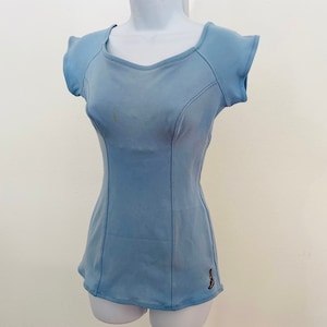 True vintage light blue jantzen swimsuit. Helanca Nylon. Cap Sleeves. Cute light blue 1950s swimsuit with swimmer. size M modest cute