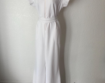 size M White Friday night fever Jumpsuit. 1970’s All poly. Belted. Disco.