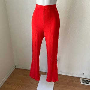 Vintage 1970&#39;s pleat front burnt orange stretchy bellbottoms. Pants. size small Awesome Hippie Pants. Cute Butt. Classic 1970&#39;s Hippie Style