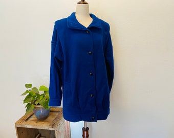 1980s wool Blue wool coat. International Scene. Size medium to large. European Wool Coat. Bright Blue. Warm. Fashionable. Lined. Pockets.