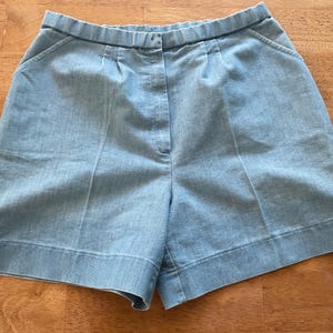 1960s blue and white striped cotton cutoffs. Metal zip. Pockets. Denim. Tattered. Broken in. Cute classic true vintage short cutoffs