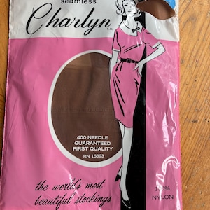 May include: A package of Charlyn seamless stockings containing 1 pair of 100% nylon hosiery. The white and pink packaging features an illustration of a figure in a dress, the text 400 NEEDLE GUARANTEED FIRST QUALITY, and the world's most beautiful stockings.