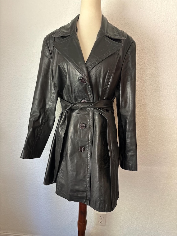1970's/1980s Belted black leather trench coat by MG Ward "The tannery." Size M.