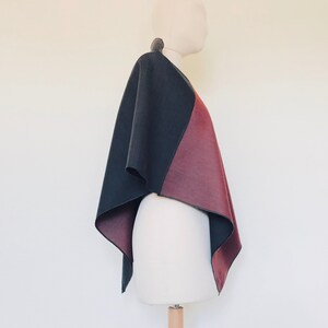 Fashionable wool cape in red and grey tones