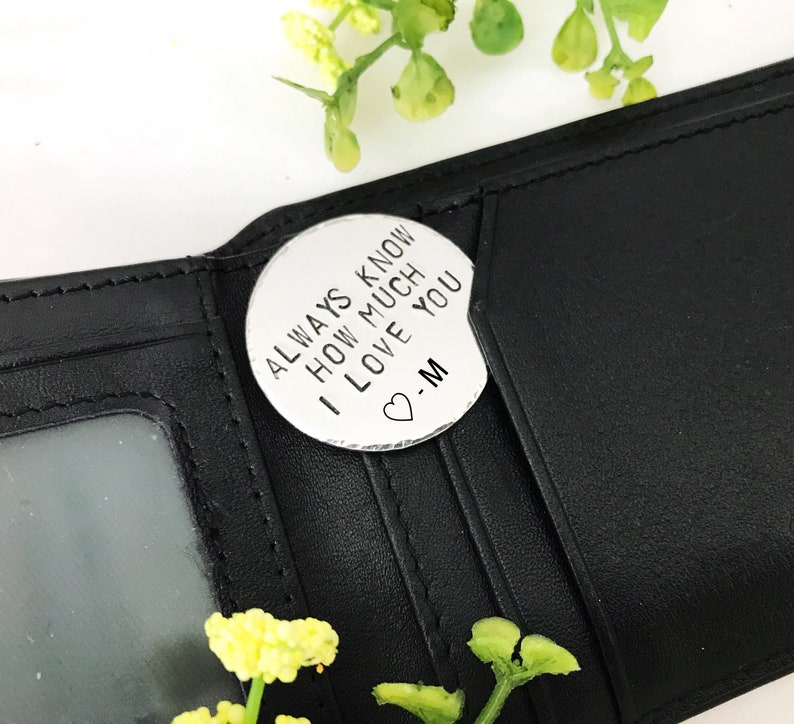 May include: A silver-toned metal token with the inscription "Always know how much I love you -M" and a small heart symbol.