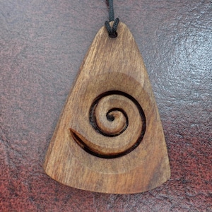 NZ pine wood Maori Koru spiral pendant. W118