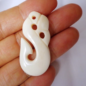 Bone fish hook pendant . B12