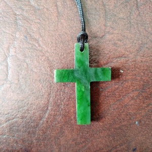 Nephrite jade cross pendant .  S546