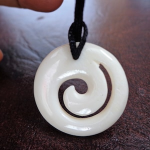 Bone Maori Koru spiral pendant . B18