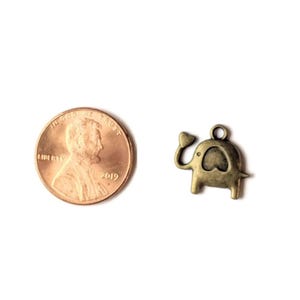 Antique Bronze Ornamental Elephant Head Charm - - LadybugfeetDesigns -
