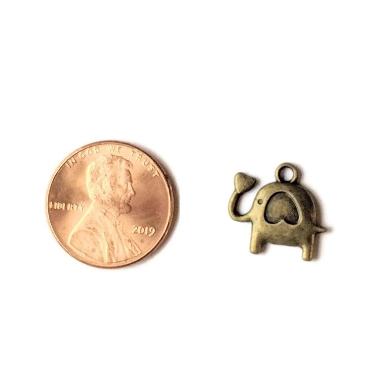 Antique Bronze Ornamental Elephant Head Charm - - LadybugfeetDesigns -