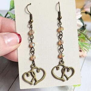Antique Bronze Boho Double Heart dangle earrings - - LadybugfeetDesigns -