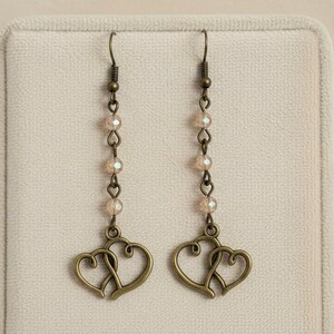 Antique Bronze Boho Double Heart dangle earrings - - LadybugfeetDesigns -