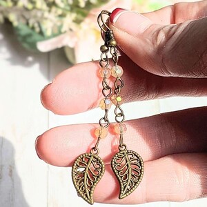 Antique Bronze Filigree Leaf dangle earrings - - LadybugfeetDesigns -